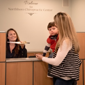 Patients Being Greeted Reception Desk