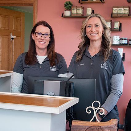 Doctor and staff behind desk