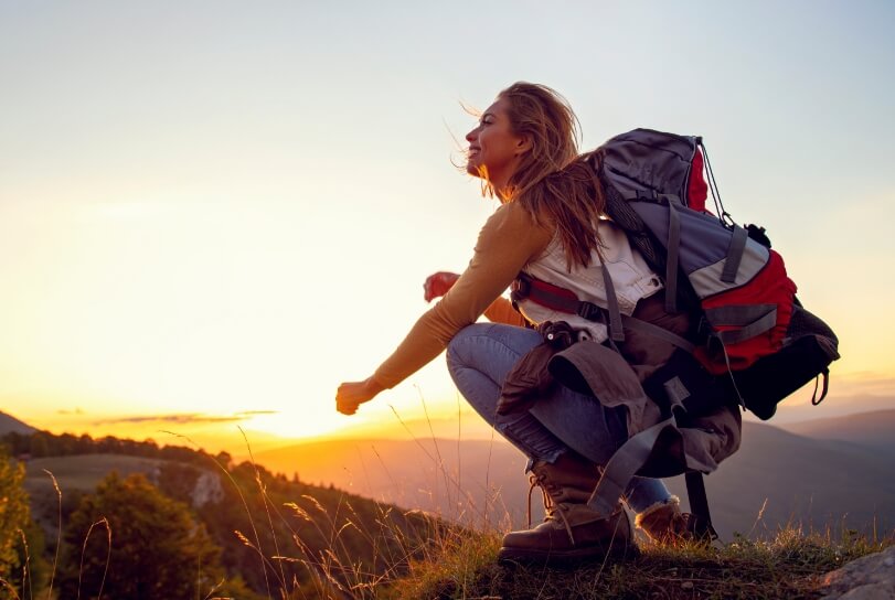 woman looking at sunrise