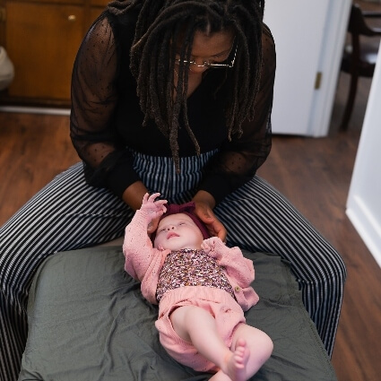 Dr Ashley adjusting baby