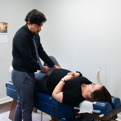 Dr Jose talking with pregnant patient
