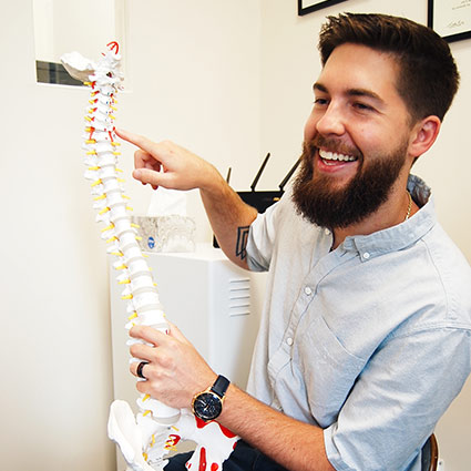 chiropractor with spine model