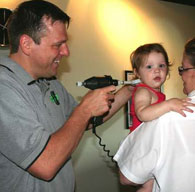 Dr. Usher adjusting a child.