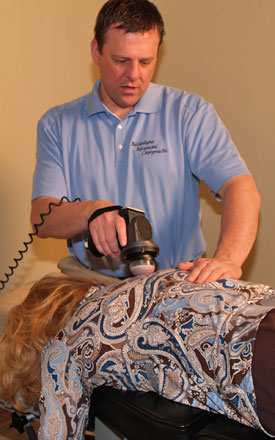 Dr. Jason adjusting woman