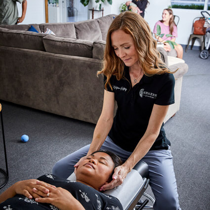 dr victoria of Awaken Chiropractic Center adjusting patient