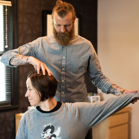 Chiropractor stretching Lee's Summit patient's arm