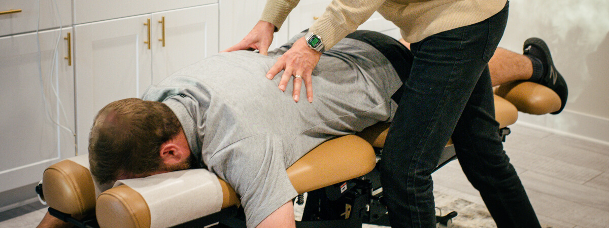 Lee's Summit chiropractor adjusting a patient's back