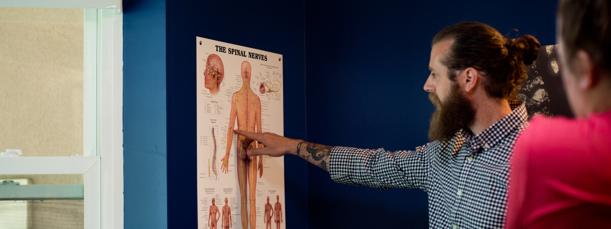 Lee's Summit chiropractor in consultation with patuients