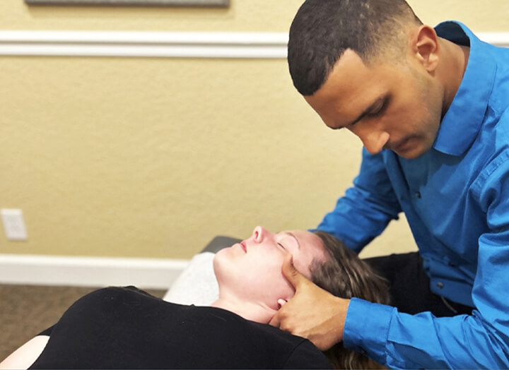 Doctor adjusting patient