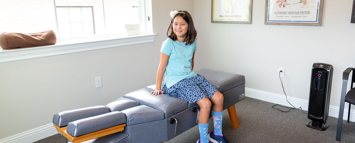 child on adjusting table