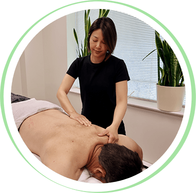 Chiropractor massaging client