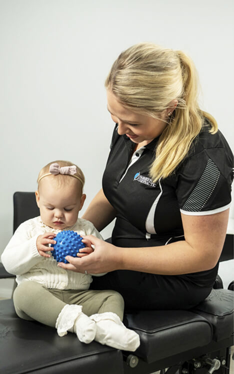 Dr Karina assistant playing with baby