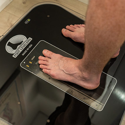 feet being scanned for orthotics