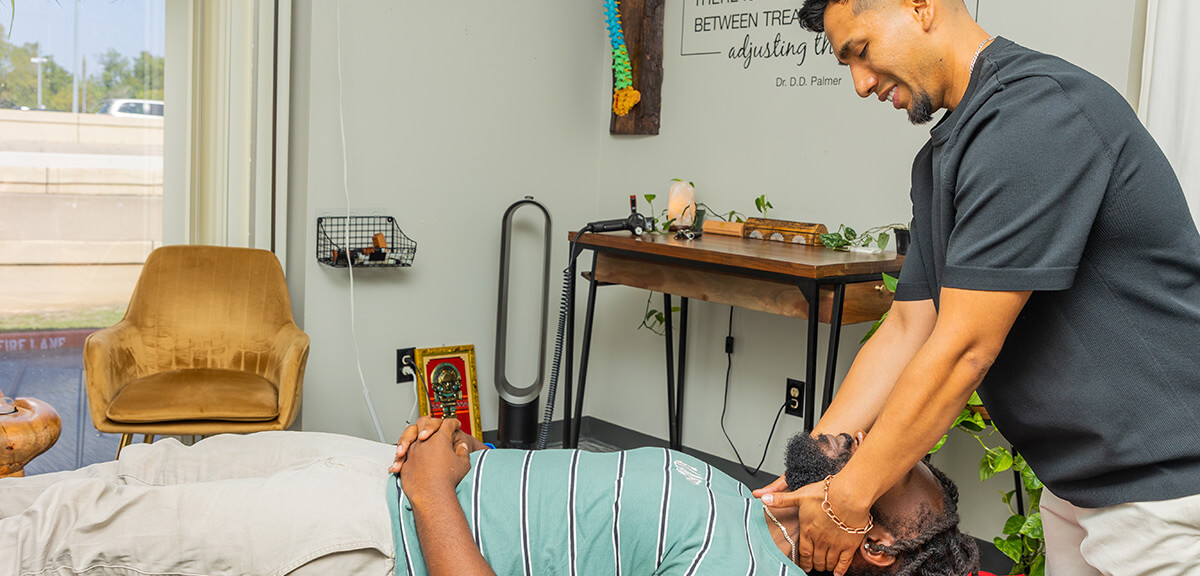 Dr Paul adjusting patients neck