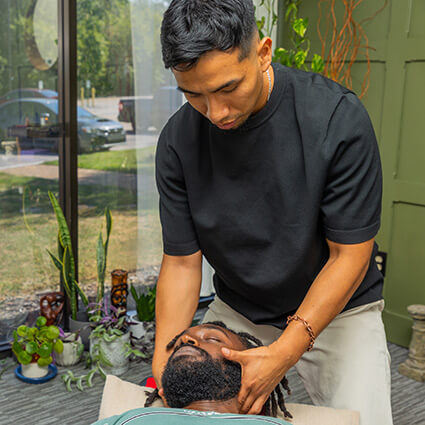 Dr Paul adjusting patients neck