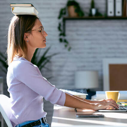 woman-sitting-up-tall-with-books-on-head-sq