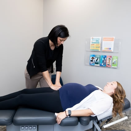 Pregnant woman being adjusted
