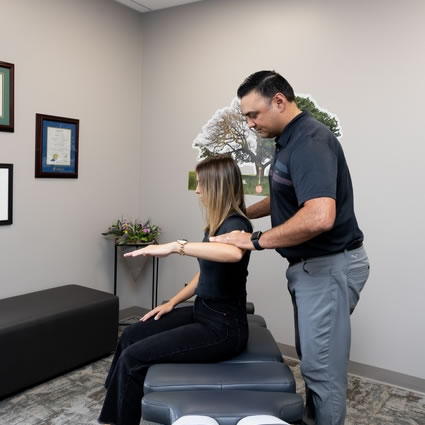 Doctor testing patient's arm