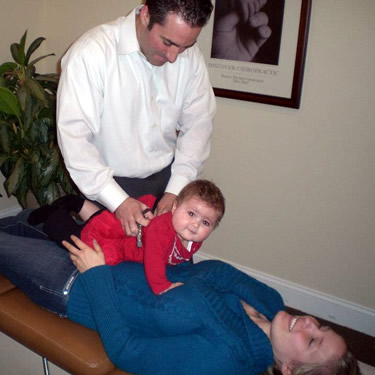 Dr Bret adjusting baby