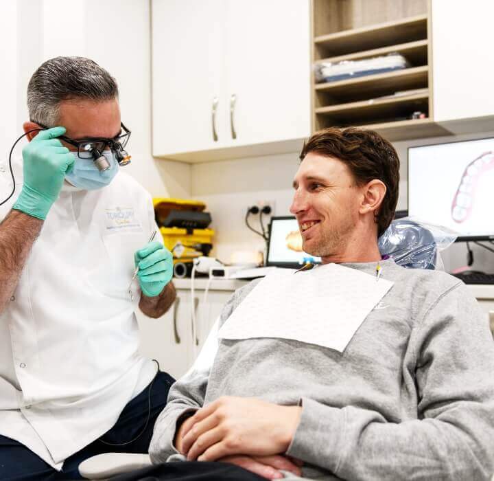 dr checking a guys teeth