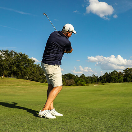 Man-golfing-on-a-sunny-day