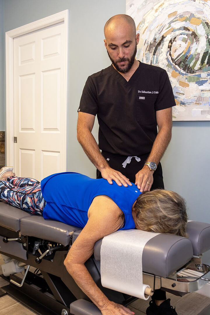 Chiropractor adjusting patient