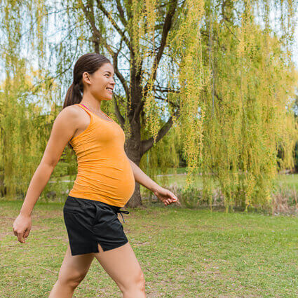healthy-expectant-mother-exercising-outdoors-sq