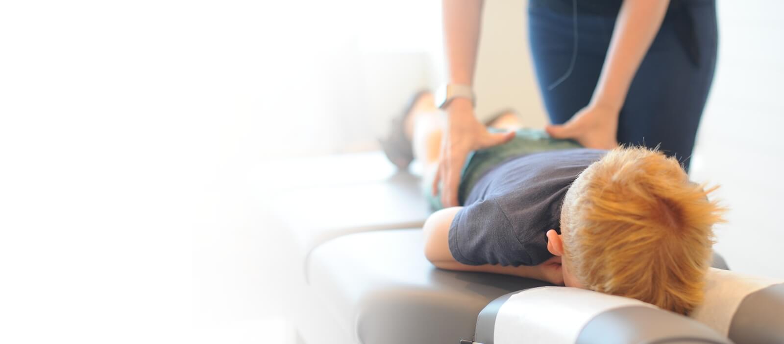 child having back adjusted