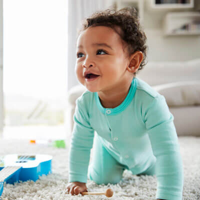 happy baby playing at home