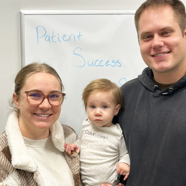 family at Crossroads Chiropractic office