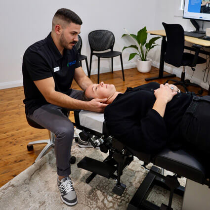 Dr Alex adjusting patients neck