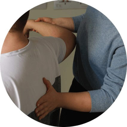 chiropractor touching persons back