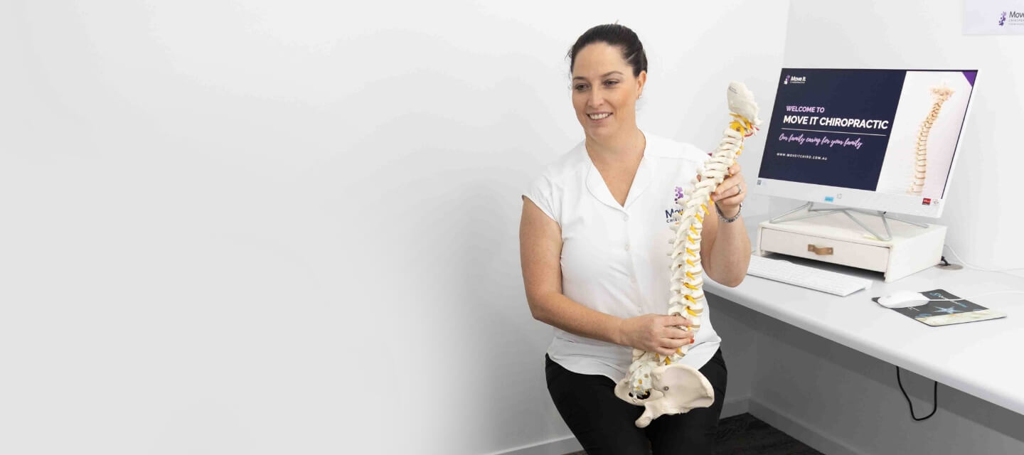 Dr holding spine model