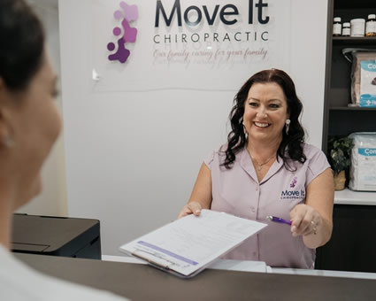 Staff holding paperwork