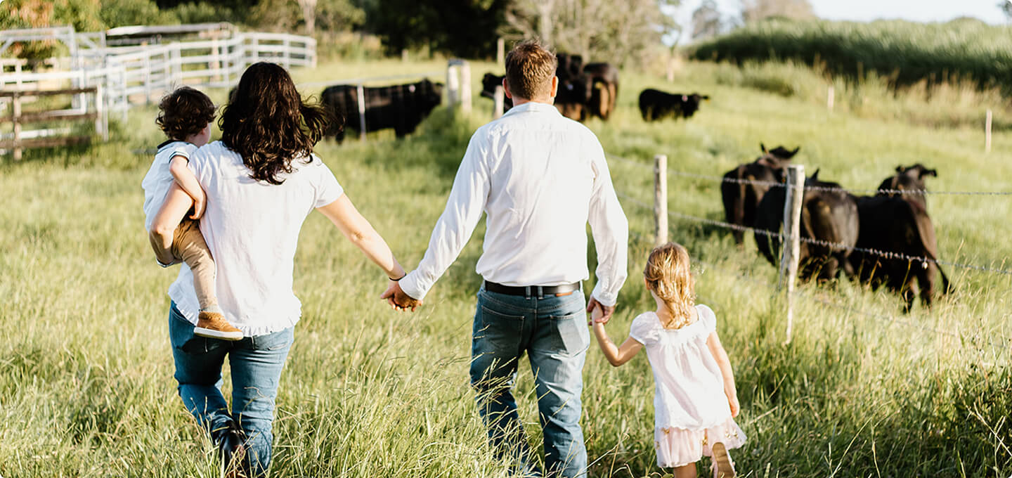 family walking in a field