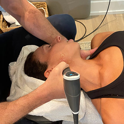 shockwave treatment on persons neck