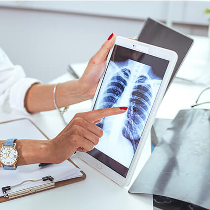 person pointing at digital xray