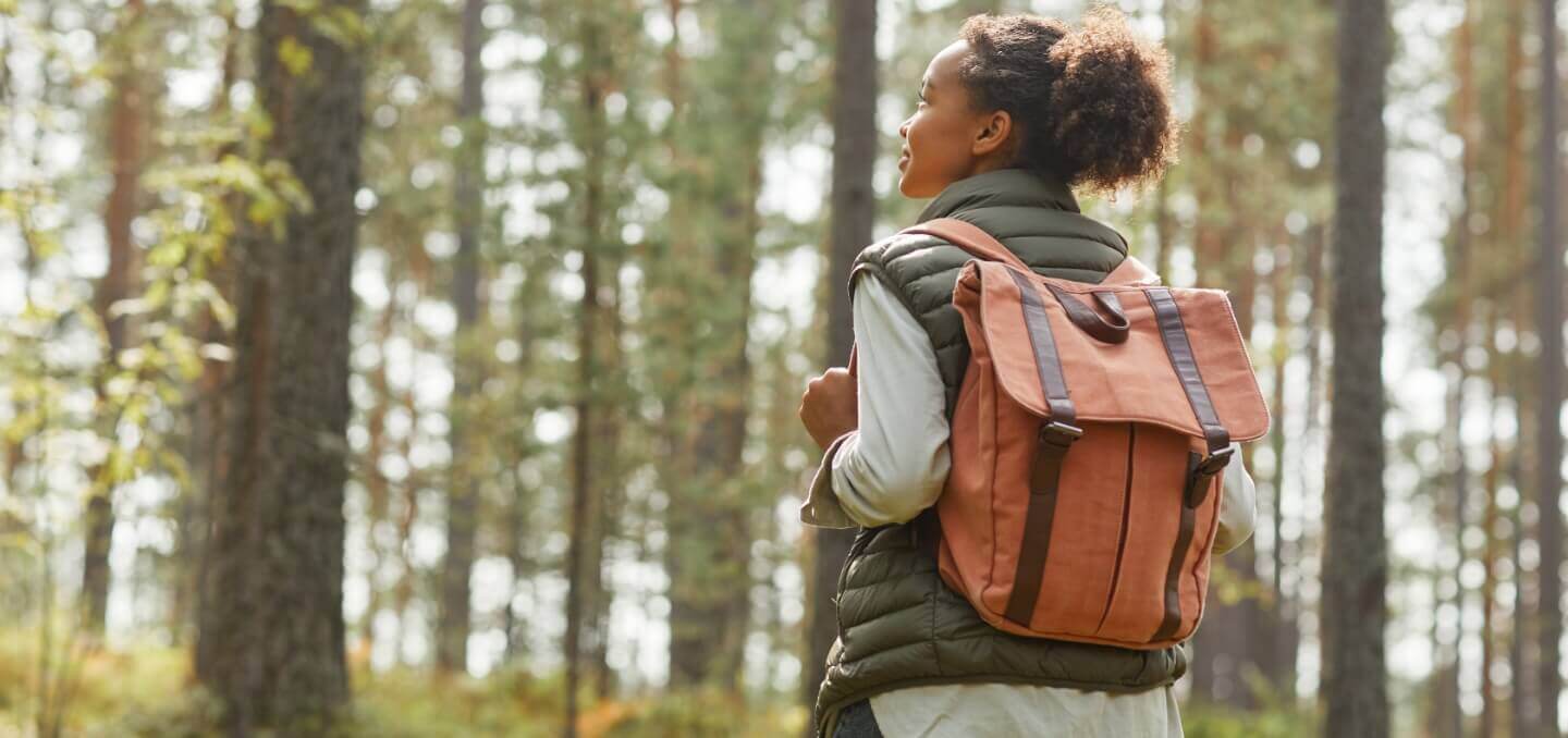 person trekking in the forest