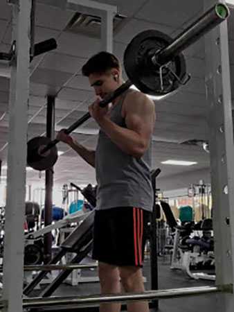 Kam lifting weights