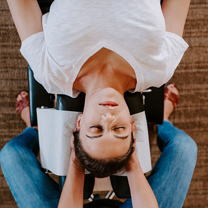 person having neck adjusted