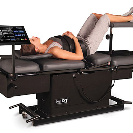 Woman lying on spinal decompression therapy table