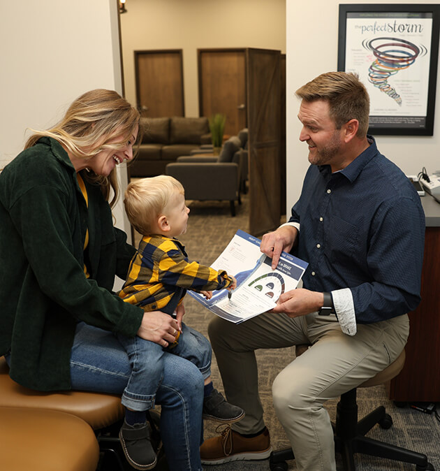 Chiropractor with child patient