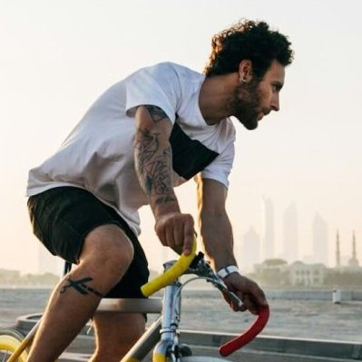 man riding bicycle on road during daytime