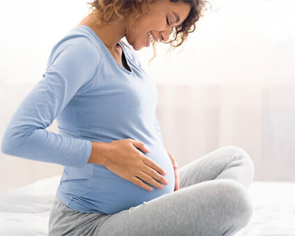 Mom smilling at belly