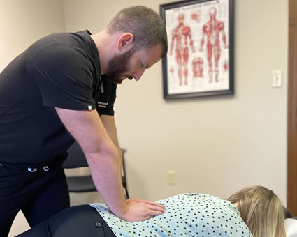 Adjusting woman's back