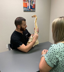 Dr. Brad holding spine model