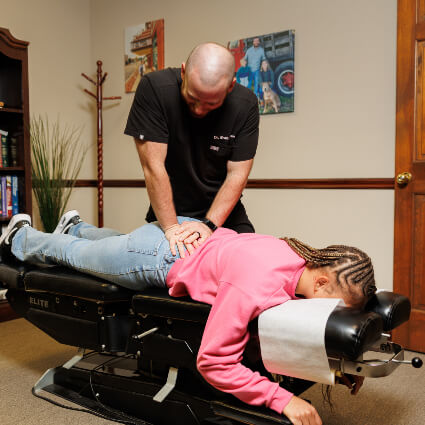 Glen Carbon Chiropractor Dr. Brad adjusting patient's lower back