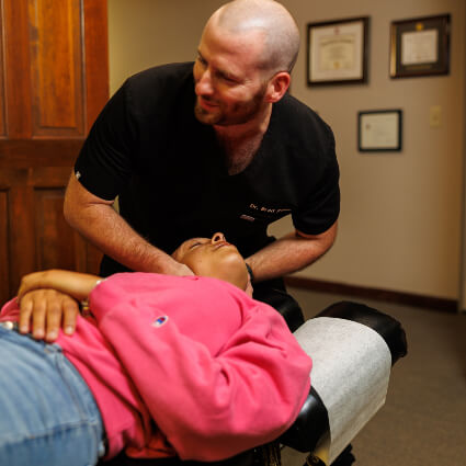 Dr. Brad doing neck adjustment