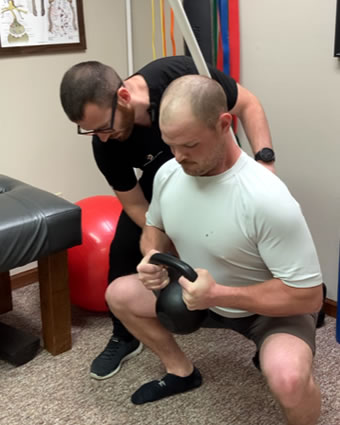 Man holding kettlebell