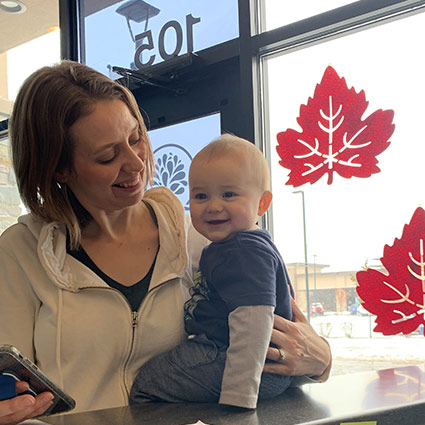 Mom and baby at front desk